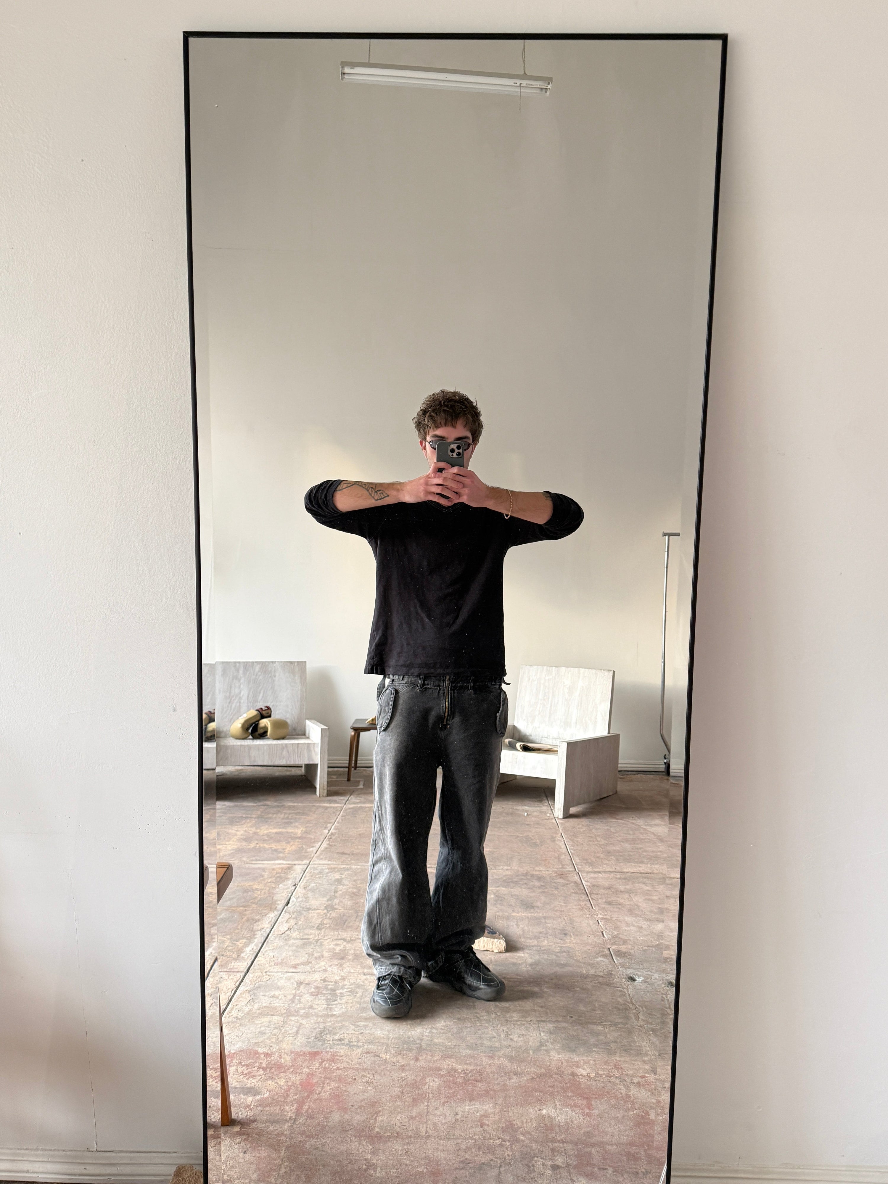 kleinian takes a photo of himself in the mirror